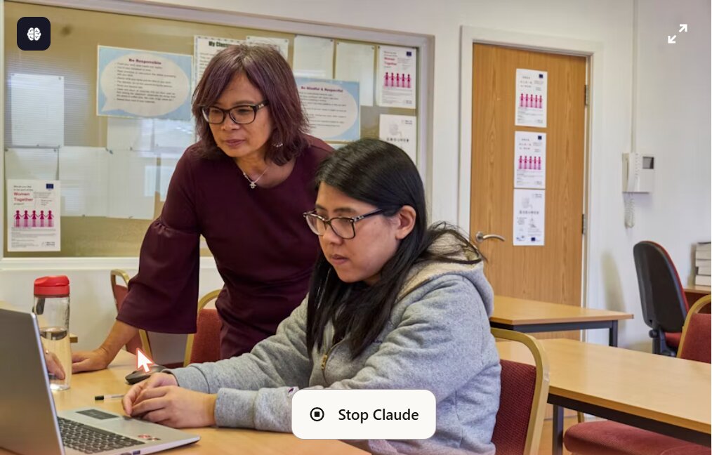 Tutor helping a student on a laptop in a one-to-one session